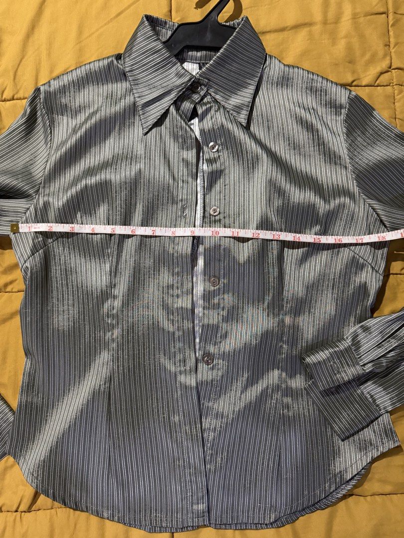 Grey Striped Long Sleeve Button Up Shirt (Category: Tshirts & Polo Shirts ) located in Mandaluyong City. Submitted by xela.tings (Listing ID 1460016447, Image 3). Description: Grey button-up shirt Subtle vertical stripes Long sleeves with button cuffs Fabric has a slight sheen .