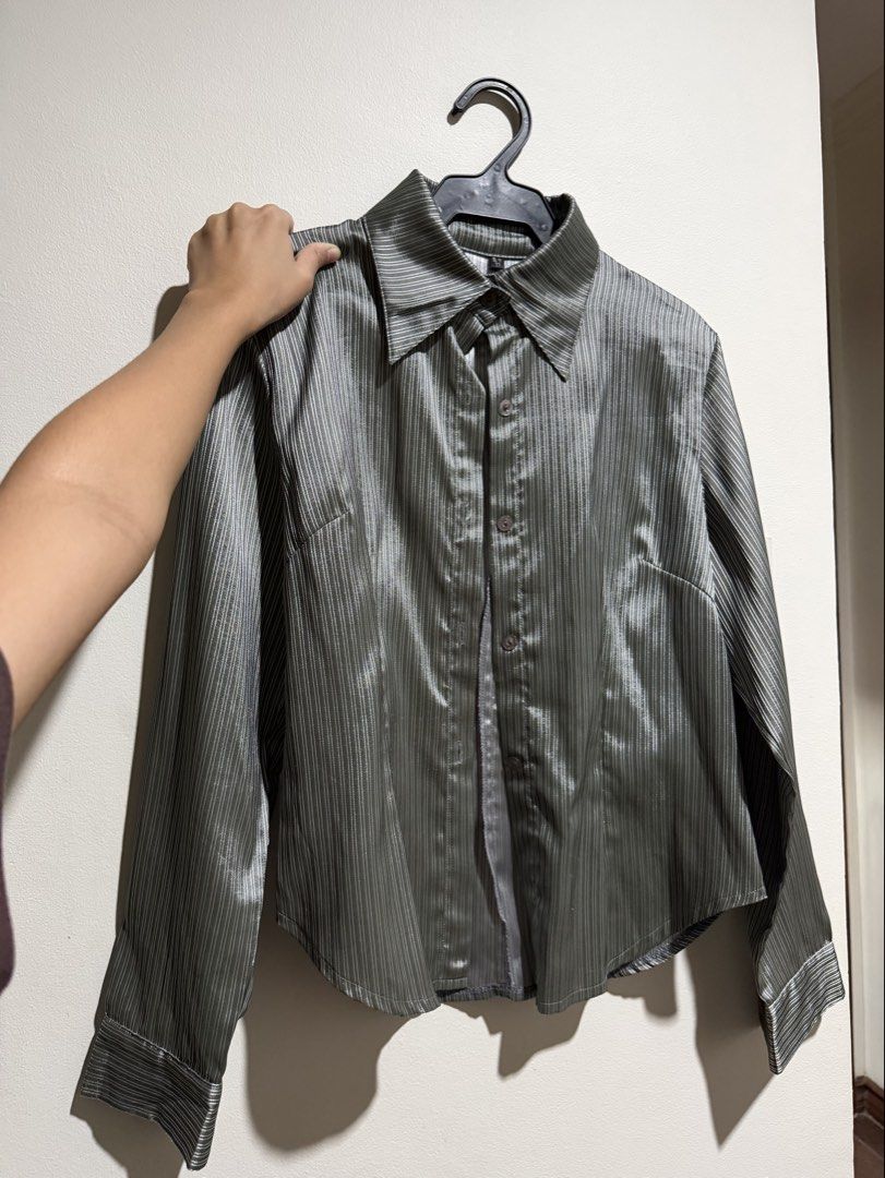 Grey Striped Long Sleeve Button Up Shirt (Category: Tshirts & Polo Shirts ) located in Mandaluyong City. Submitted by xela.tings (Listing ID 1460016447, Image 1). Description: Grey button-up shirt Subtle vertical stripes Long sleeves with button cuffs Fabric has a slight sheen .