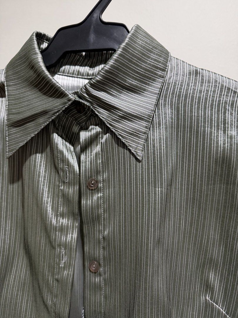 Grey Striped Long Sleeve Button Up Shirt (Category: Tshirts & Polo Shirts ) located in Mandaluyong City. Submitted by xela.tings (Listing ID 1460016447, Image 2). Description: Grey button-up shirt Subtle vertical stripes Long sleeves with button cuffs Fabric has a slight sheen .