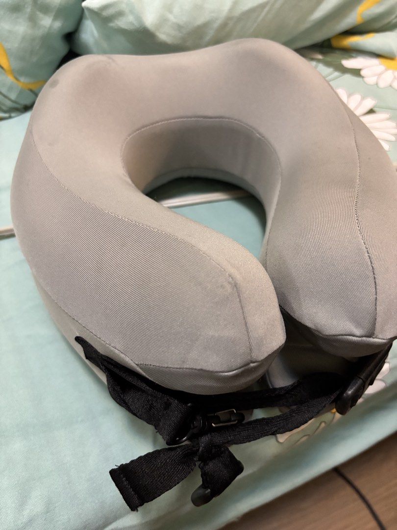 Grey Travel Neck Pillow with Buckle Strap (Category: Travel Essentials & Accessories) located in Malabon City. Submitted by luxgoals (Listing ID 1460016089, Image 1). Description: - Grey travel neck pillow - Features a secure buckle strap - Fabric has faint marks (refer to close-up photos) - Ideal for long journeys and naps - Compact and easy to pack.