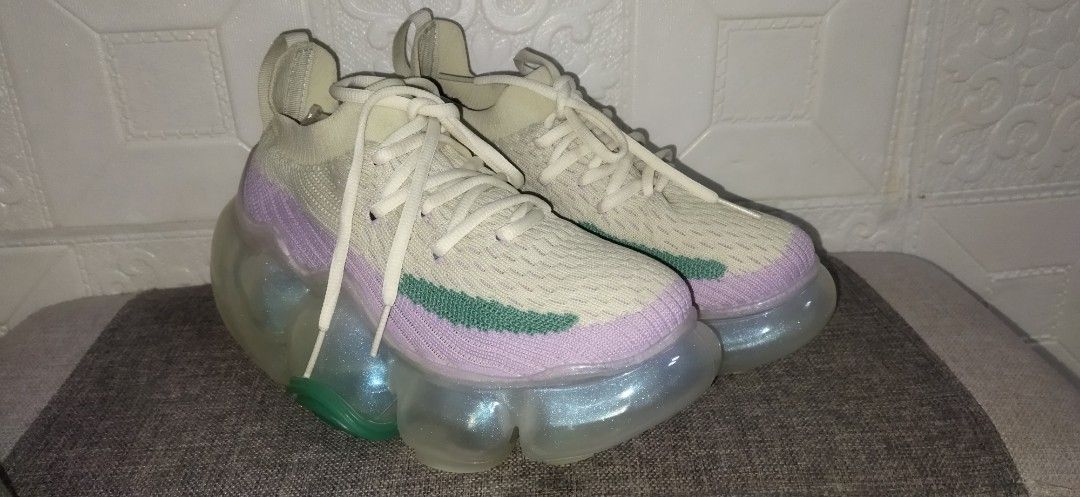GROUNDS MOOPIE T2 Clear Bubble Sneakers (Category: Sneakers) located in Santa Cruz. Submitted by madonnaching (Listing ID 1460009347, Image 1). Description: - Grounds sneakers - Unique clear bubble sole with iridescent colors - Light cream knit upper with pastel purple and green accents - Super comfy and stylish - Comes with original tags.