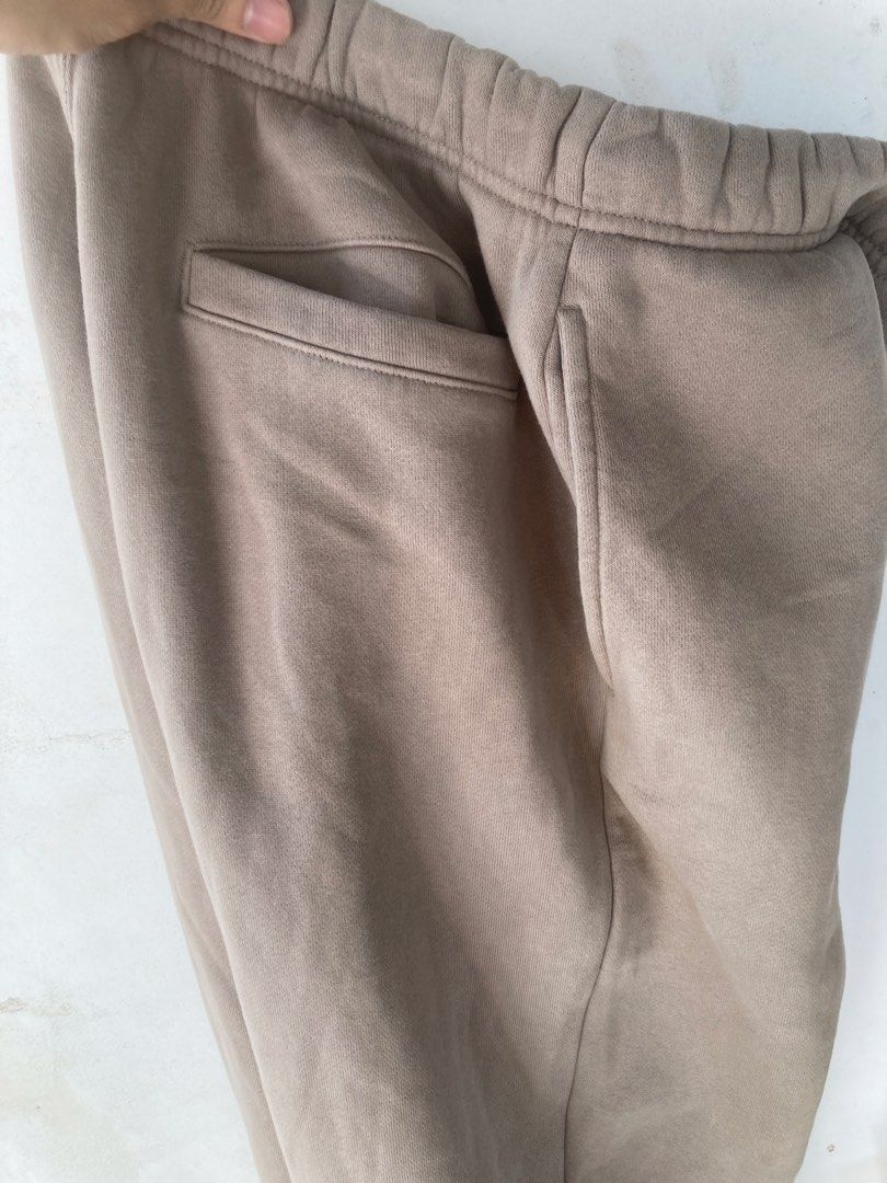 GU Sweatpants M Beige Cotton Polyester Joggers (Category: Joggers) located in Tacloban City. Submitted by sid1999 (Listing ID 1459977856, Image 3). Description: - Comfortable beige sweatpants from GU - Made with a cotton and recycled polyester blend - Features an elastic waistband with drawstring - Includes two side pockets and one back pocket - Cuffed ankles for a snug fit - Ideal for lounging or casual wear fits 28-32.