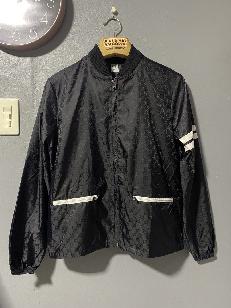 Gucci Monogram Track Jacket Black (Category: Luxury Apparel) located in Tanay. Submitted by judevalcorza (Listing ID 1460098830, Image 1). Description: - Gucci track jacket - All-over GG monogram pattern - White stripe detail on sleeves - Zip-up front with two zip pockets - Ribbed collar and cuffs - Size: Small - Measurements: Length 25", Width 21" - Excellent Missing Maintag - 1850 Fix From 2500 - Shipping Is Shoulder of the Buyer.