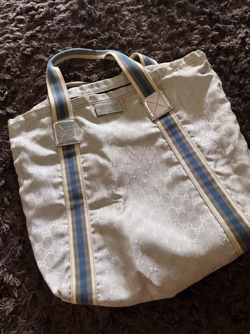 Gucci Vintage Silver GG Monogram Tote Canvas Web (Category: Luxury Bags & Wallets) located in Antipolo. Submitted by pinkktopaz (Listing ID 1459989460, Image 1). Description: Well used with stains/discoloration near top handle Guaranteed authentic As is.