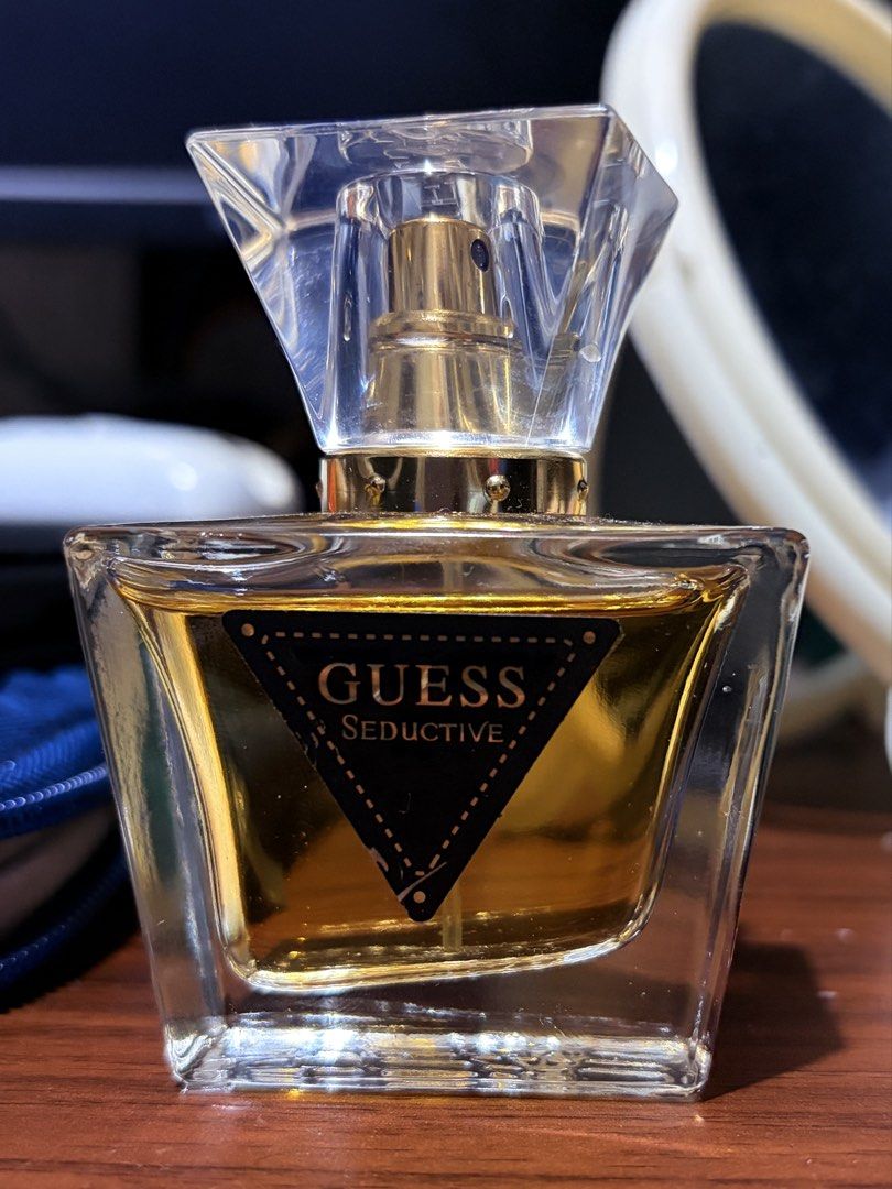 Guess Seductive Eau de Toilette for Women (Category: Fragrance & Deodorants) located in Calasiao. Submitted by looos_hoard (Listing ID 1459918656, Image 1). Description: - Guess Seductive Perfume for Women - Size: 30ml bottle - Scent Profile: Lovely floral and fruity mix - Versatile: Great for everyday wear or a night out - Bottle Design: Clear glass with gold spray nozzle, faceted clear cap - Label: Black with gold lettering RFS: decluttering, F