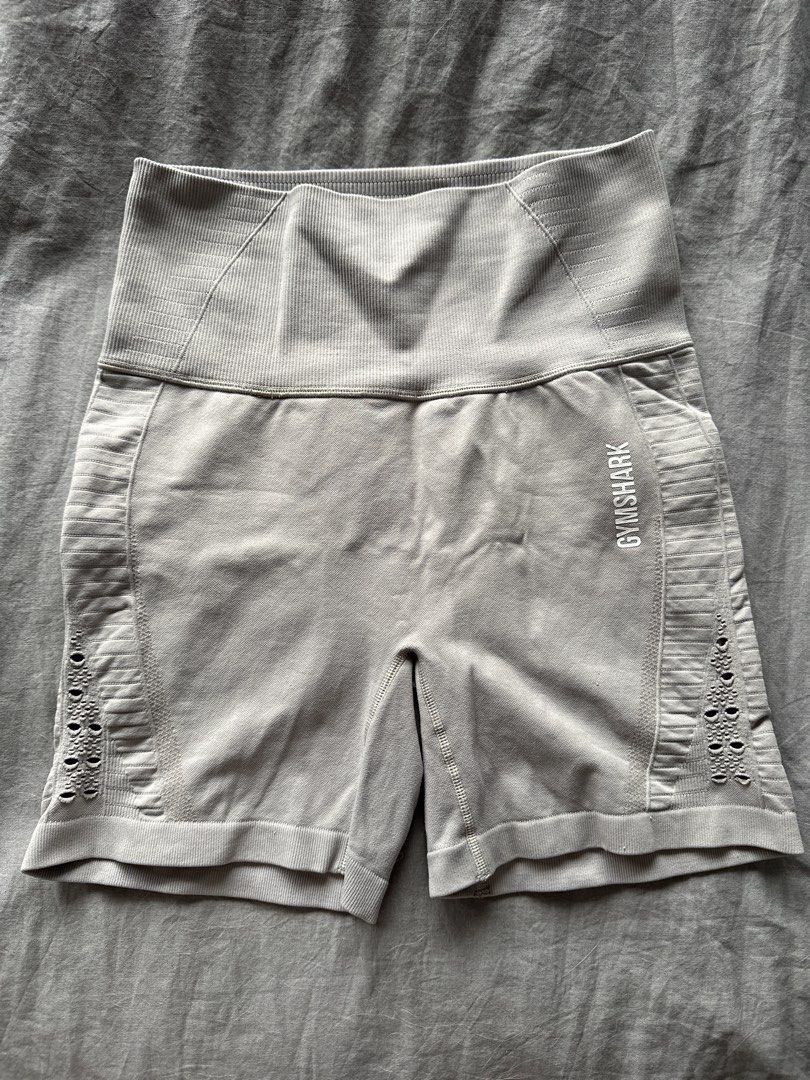 Gymshark Seamless Cycling Shorts - Light Grey (Category: Activewear) located in Manila. Submitted by rhaphina (Listing ID 1459999185, Image 1). Description: - Gymshark seamless cycling shorts in light grey - High-waisted design with a supportive ribbed waistband - Stylish textured detailing and trendy side cut-outs - Comfortable and provides excellent support for all your workouts - Ideal for running, gym sessions, or casual lounging.