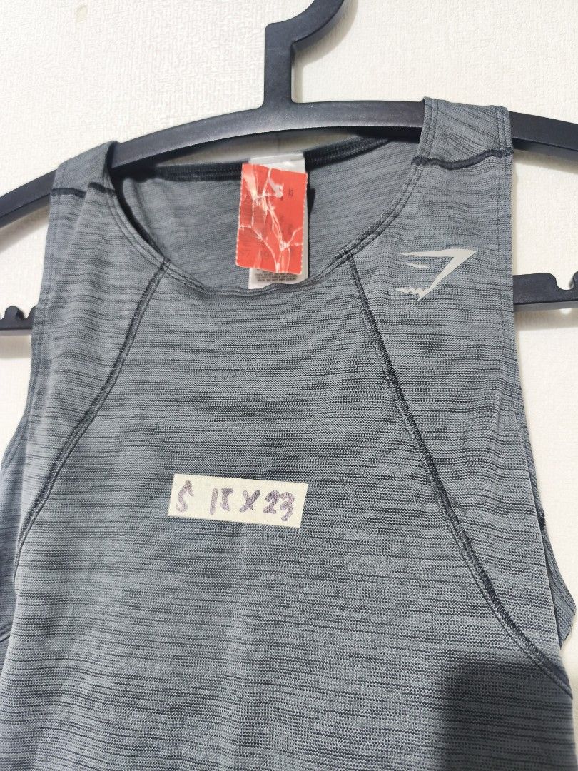 Gymshark Training Tank Top - Dark Grey (Category: Activewear) located in Pasay City. Submitted by tananoy0508061 (Listing ID 1460103734, Image 2). Description: - Gymshark training tank top - Dark grey marl color - Racerback design for full mobility - Lightweight and breathable fabric - Ideal for workouts and everyday wear - Please check photos for condition details.