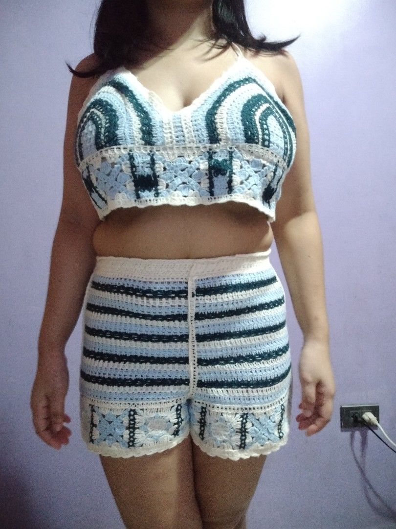 Crochet Crop Top and Shorts Set (Category: Sets or Coordinates) located in Marikina City. Submitted by rareocean_9df934 (Listing ID 1460078187, Image 1). Description: - Handmade crochet crop top and shorts set - Halter neck top with striped pattern - Shorts with comfortable elastic waistband - Floral trim at the hem of the shorts - Ideal for beach days, festivals, or casual wear - Unique and stylish handmade design.