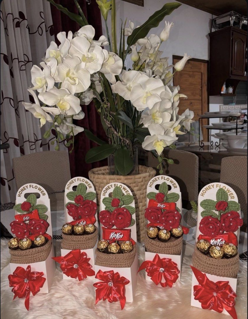 Handmade Crocheted Flower Gift Boxes with Chocolates (Category: Handmade Craft) located in Manila. Submitted by keenfox-84bb (Listing ID 1460096753, Image 1). Description: - Beautiful handmade crocheted flowers - Presented in elegant gift boxes - Includes popular chocolates like Ferrero Rocher and KitKat - Available designs: Red Roses, Pink Roses, White Orchids - Perfect for any occasion, a unique and thoughtful gift.