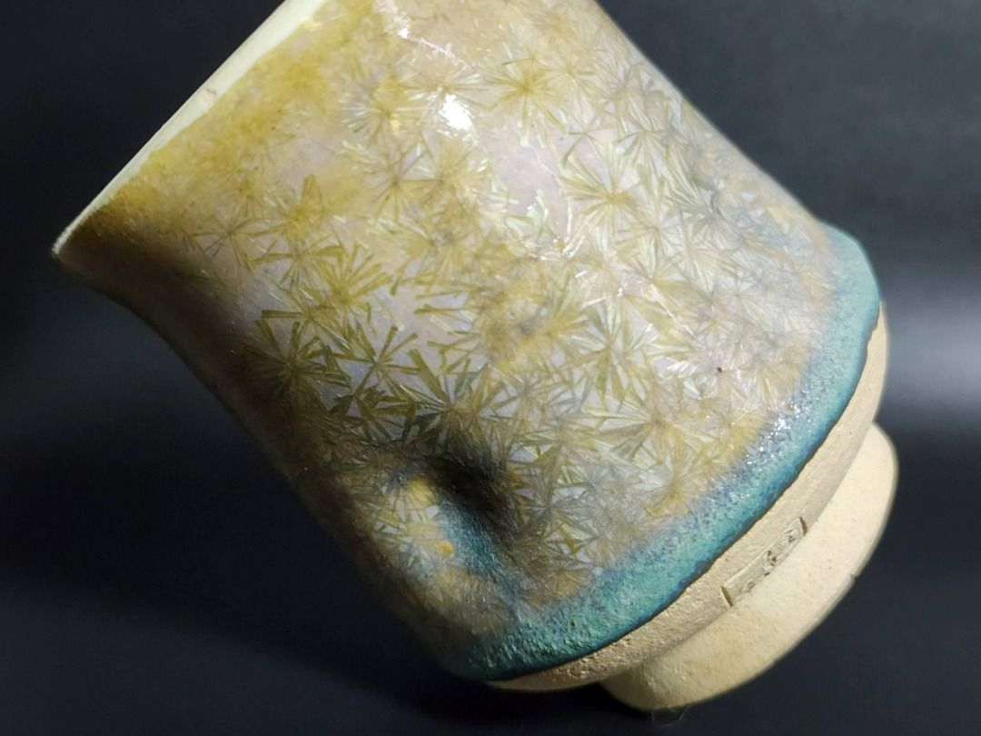 Handmade Crystalline Glaze Teacup (Category: Dinnerware & Cutlery) located in Quezon City. Submitted by lacasetta (Listing ID 1460031568, Image 3). Description: Refined handmade ceramic teacup distinguished by an expressive crystalline glaze, transitioning from pale yellow and ivory to turquoise, with naturally formed starburst-like crystal patterns. The controlled irregularity of the glaze gives the piece a distinctly studio-ceramic character, w