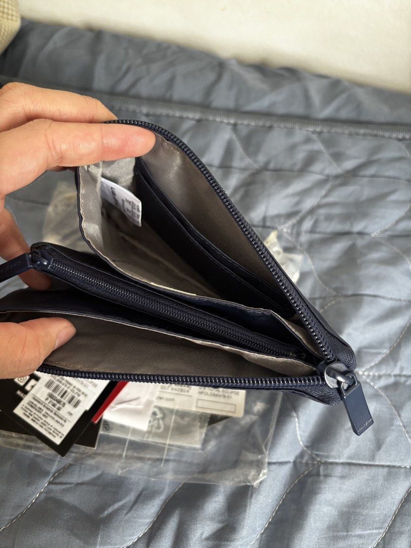 Hedgren Pouch (Category: Purses & Pouches) located in Manila. Submitted by declutter_byjaq (Listing ID 1459987601, Image 3). Description: Hedgren Follis Franc Medium Bought at Hedgren SM Mall of Asia In good condition RFS: Needs Cash.
