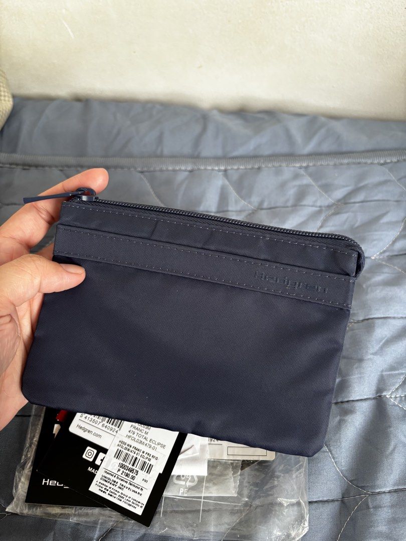 Hedgren Pouch (Category: Purses & Pouches) located in Manila. Submitted by declutter_byjaq (Listing ID 1459987601, Image 2). Description: Hedgren Follis Franc Medium Bought at Hedgren SM Mall of Asia In good condition RFS: Needs Cash.