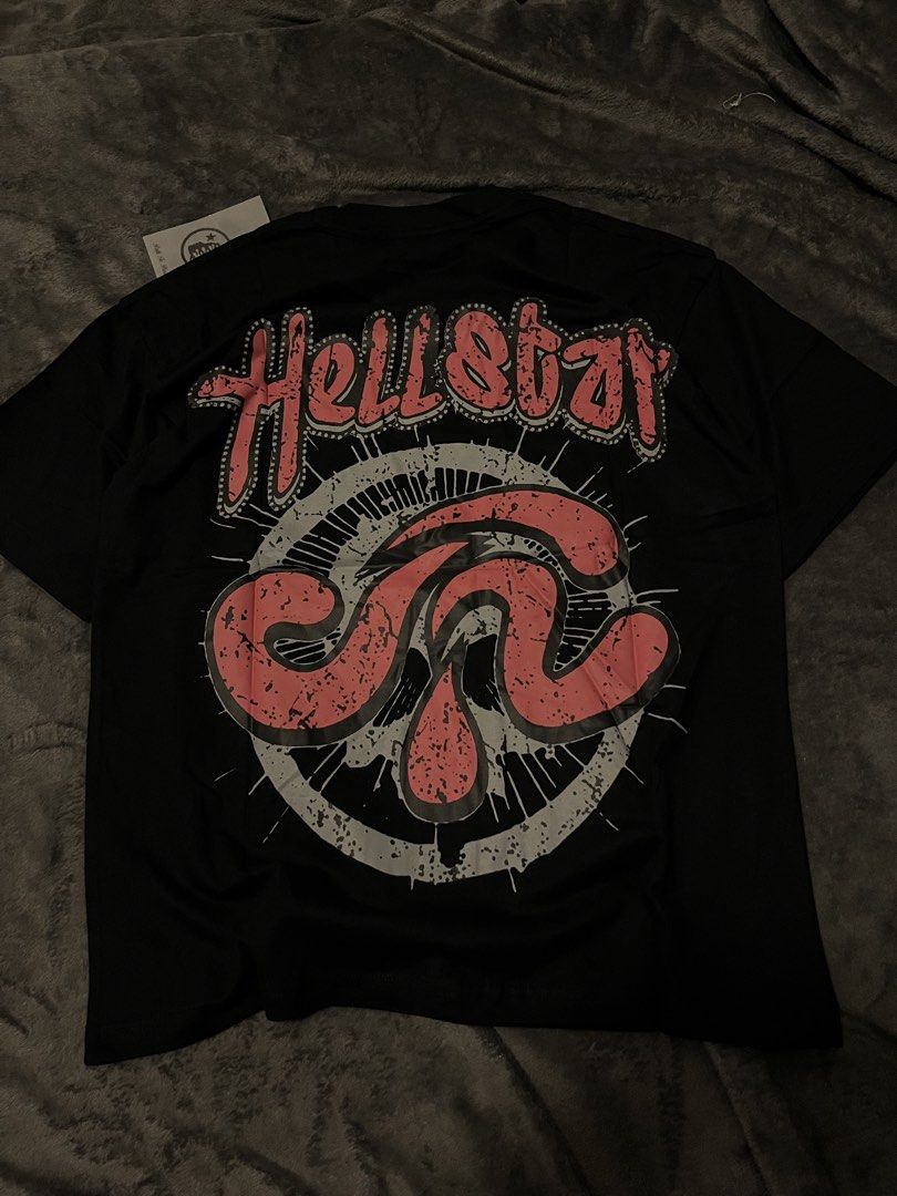 Hellstar Records Black Graphic T-Shirt (Category: Tshirts & Polo Shirts ) located in San Pablo. Submitted by yeskylle (Listing ID 1459901735, Image 2). Description: - Black Hellstar Records graphic t-shirt - Features a striking skull graphic with red star eyes on the front - Hellstar logo prominently displayed on the back - Ideal for streetwear style - Makes a bold fashion statement.