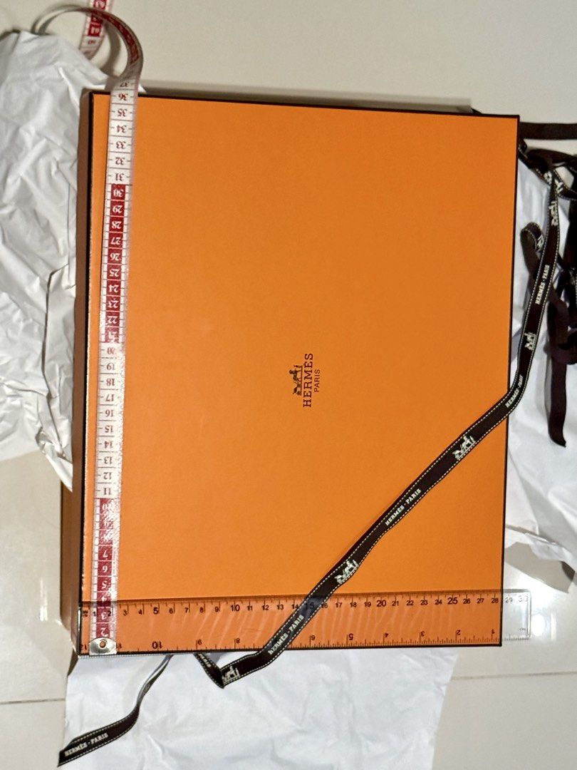 Hermes Paris Orange Box with Ribbon (Category: Luxury Accessories) located in Manila. Submitted by hotdealsph (Listing ID 1460060379, Image 1). Description: - Authentic Hermes Paris orange box - Includes original ribbon - Perfect for storing small items or as a gift box.