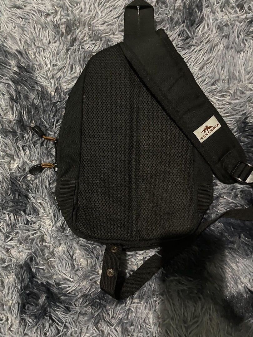 High Sierra Black Sling Bag Backpack (Category: Cross-body Bags) located in Manila. Submitted by thrift04k (Listing ID 1460098658, Image 2). Description: - Black High Sierra sling bag - Main compartment and front zip pocket - Adjustable strap for comfortable wear - Breathable mesh padding on the back - Durable material, ideal for everyday use or travel.