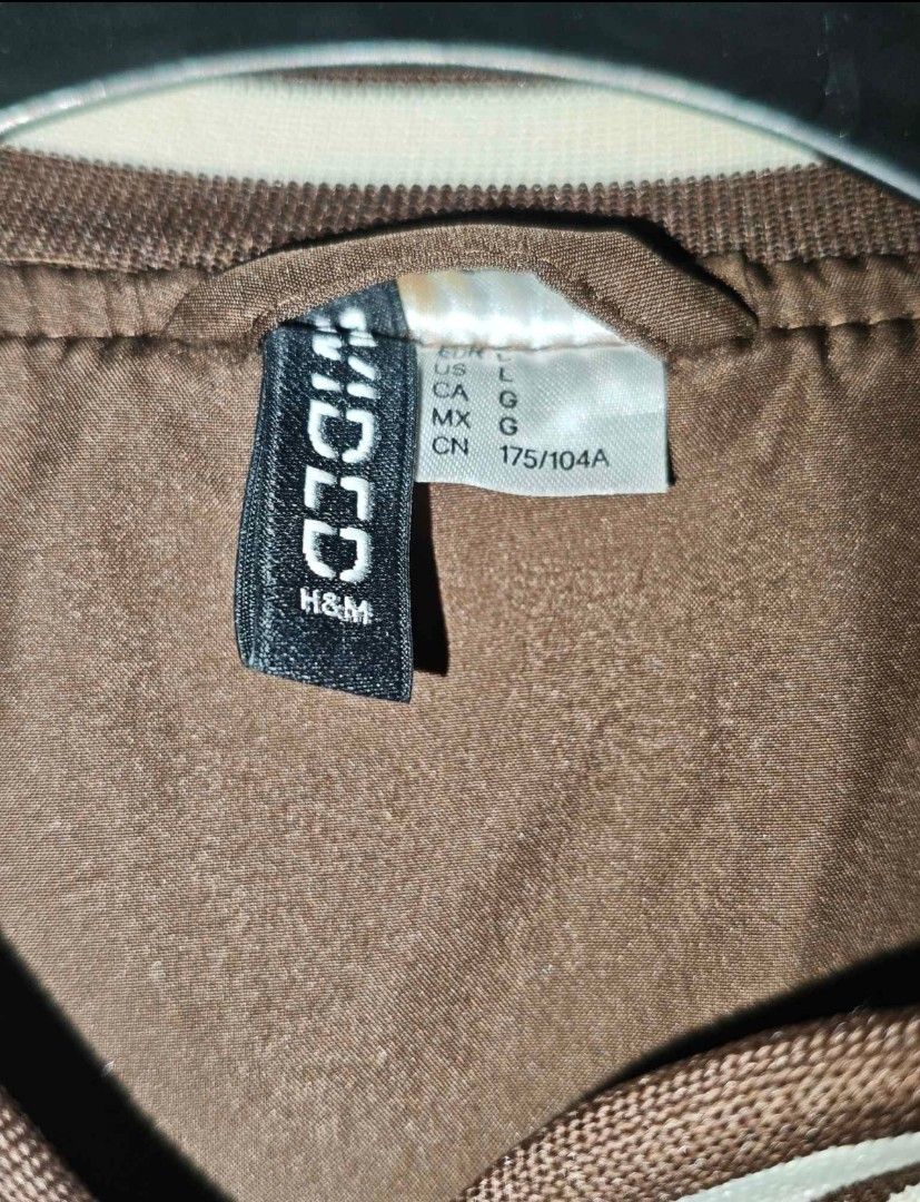 H&M Brown 'Hawks' Varsity Jacket (Category: Coats, Jackets and Outerwear) located in Manila. Submitted by civvvy (Listing ID 1460101291, Image 3). Description: FOR SALE: H&M Divided Varsity Jacket Condition: Very good condition, only minor stain/ scuff on the cream sleeve RFS: No longer using Location: Manila MOP: GCash or Bank Transfer Delivery: Lalamove FREE shipping: Around Malate and Makati area Can also do meet-up around Malate area! P1,000 