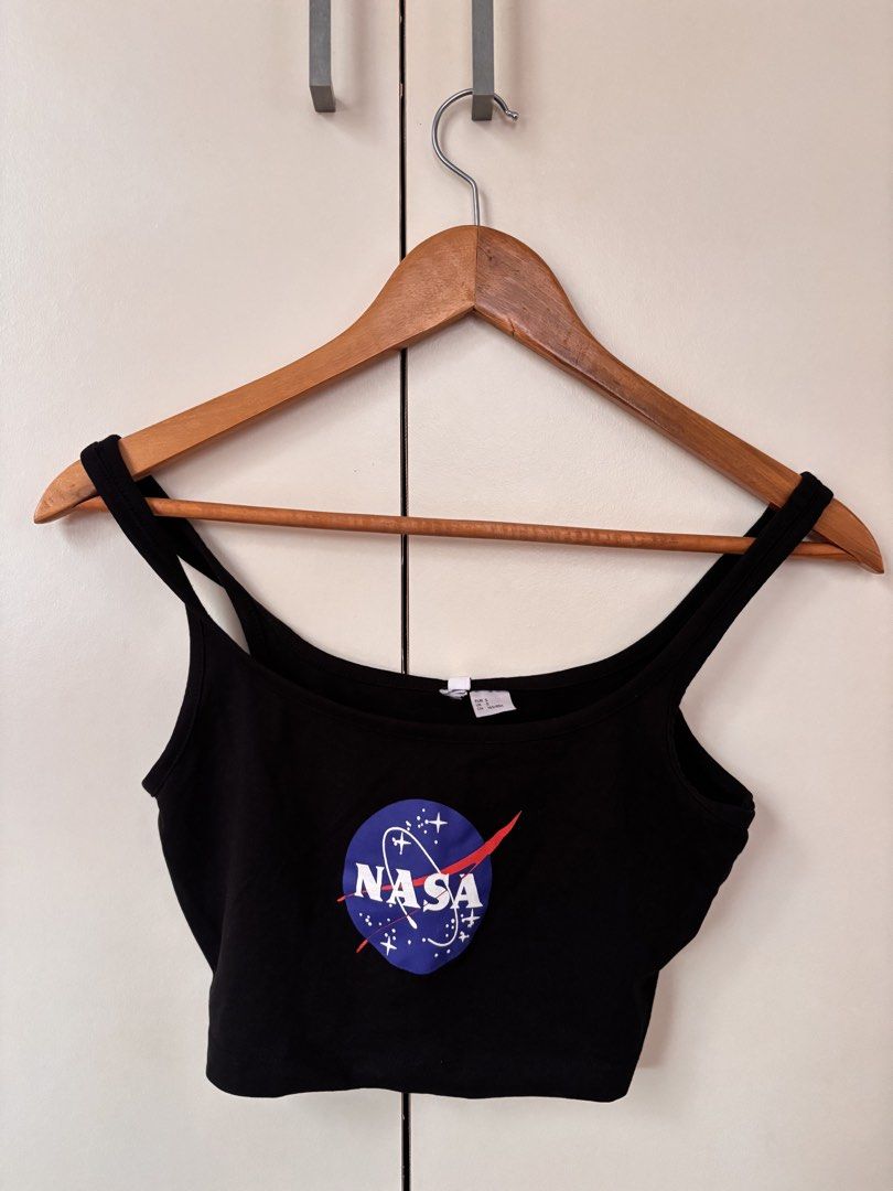 H&M Divided Black NASA Crop Top (Category: Others Tops) located in Manila. Submitted by mitzdcstr6 (Listing ID 1460004471, Image 1). Description: - Black H&M Divided crop top - Features NASA logo - Spaghetti strap design - Super comfy and casual - Perfect for everyday wear or layering - Size: S.