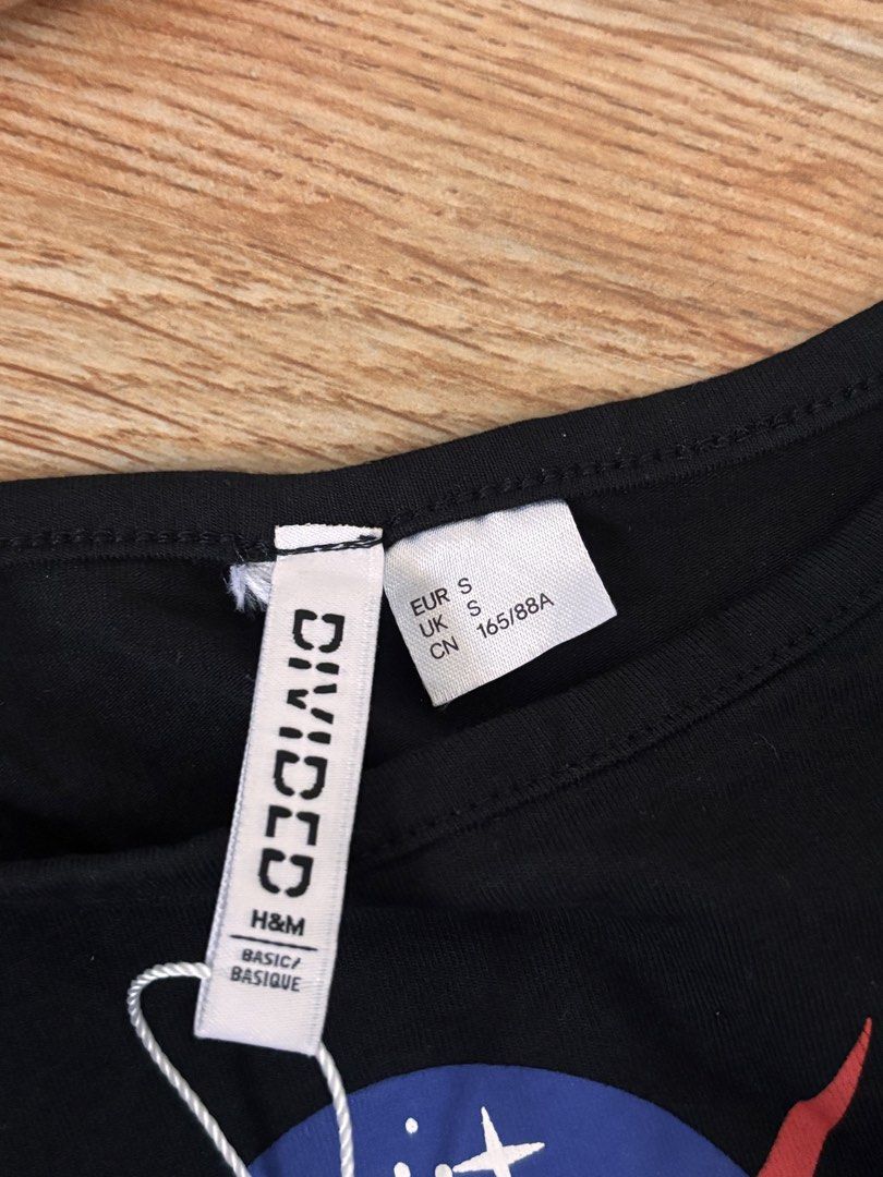 H&M Divided Black NASA Crop Top (Category: Others Tops) located in Manila. Submitted by mitzdcstr6 (Listing ID 1460004471, Image 2). Description: - Black H&M Divided crop top - Features NASA logo - Spaghetti strap design - Super comfy and casual - Perfect for everyday wear or layering - Size: S.