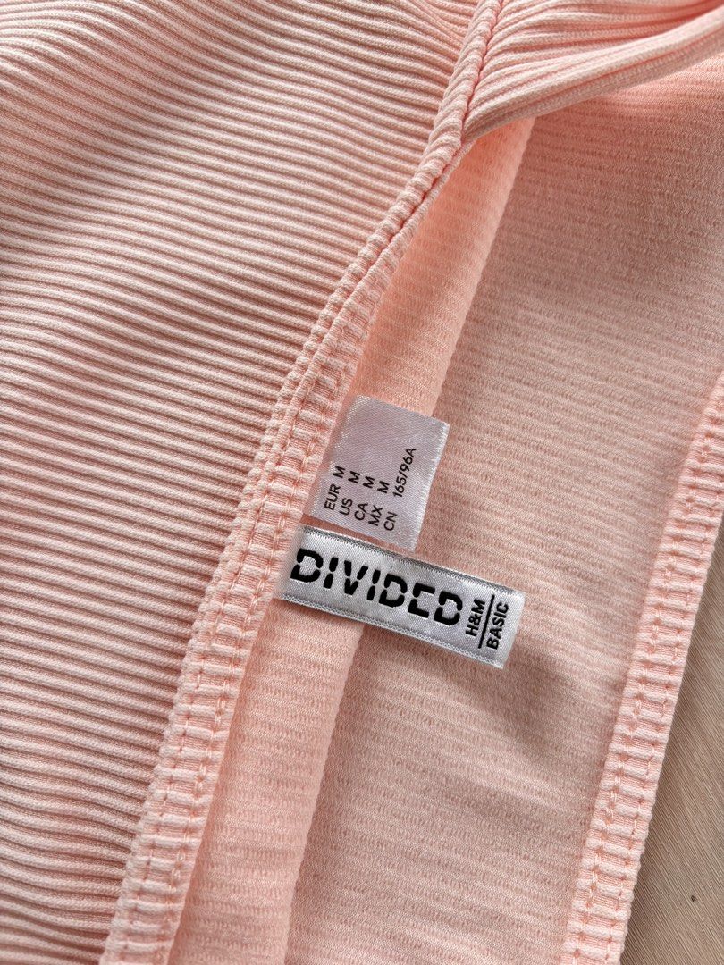 H&M Divided Ribbed Crop Top - Pink (Category: Sleeveless) located in Manila. Submitted by mitzdcstr6 (Listing ID 1459975626, Image 2). Description: - Pink ribbed crop top from H&M Divided - Features a square neckline and thick straps - Made with stretchy material for a comfortable fit - Perfect for layering or wearing as a standalone piece - Easily pairs with shorts or skirts for a casual look.