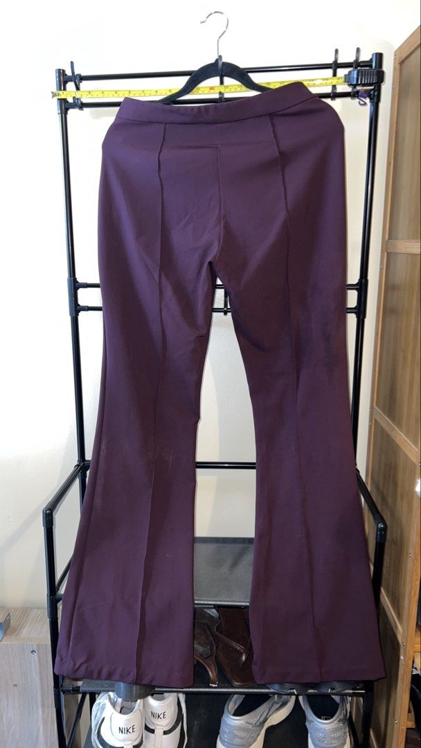 H&M Flared Trousers Burgundy Size 8 (Category: Other Bottoms) located in Mandaluyong City. Submitted by chelseayb47224 (Listing ID 1459980524, Image 2). Description: - Burgundy flared trousers from H&M - High-waisted with zipper and button closure - Classic flare leg design - Perfect for dressing up or down.