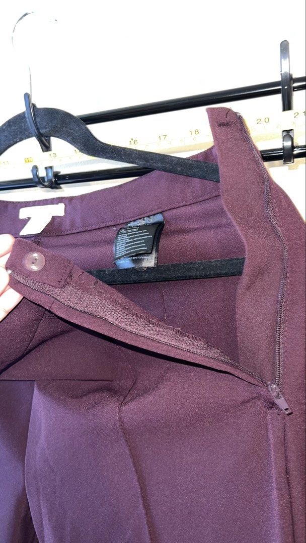 H&M Flared Trousers Burgundy Size 8 (Category: Other Bottoms) located in Mandaluyong City. Submitted by chelseayb47224 (Listing ID 1459980524, Image 3). Description: - Burgundy flared trousers from H&M - High-waisted with zipper and button closure - Classic flare leg design - Perfect for dressing up or down.