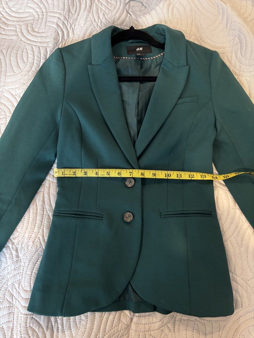 H&M Green Blazer Jacket (Category: Coats, Jackets and Outerwear) located in Cabuyao City. Submitted by thriftedwonders18 (Listing ID 1460002270, Image 2). Description: - H&M Blazer - Deep Green Color - Two-button closure - Two front pockets - Measurements: Pit to pit - 16 inches, Length - 25 inches - Versatile: Great for work or a night out.