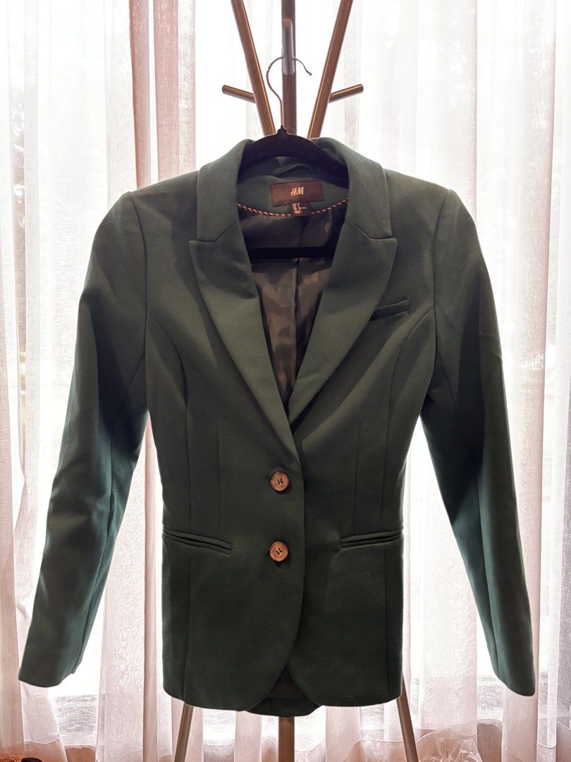 H&M Green Blazer Jacket (Category: Coats, Jackets and Outerwear) located in Cabuyao City. Submitted by thriftedwonders18 (Listing ID 1460002270, Image 1). Description: - H&M Blazer - Deep Green Color - Two-button closure - Two front pockets - Measurements: Pit to pit - 16 inches, Length - 25 inches - Versatile: Great for work or a night out.