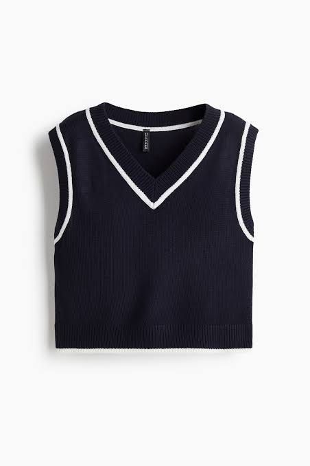 H&M navy blue sweater vest (Category: Sleeveless) located in Makati City. Submitted by isobelacs (Listing ID 1460097863, Image 1). Description: V-neck Super comfy material Slightly Cropped Has a white detail along armholes and neckline Fits loose on S Very breathable .