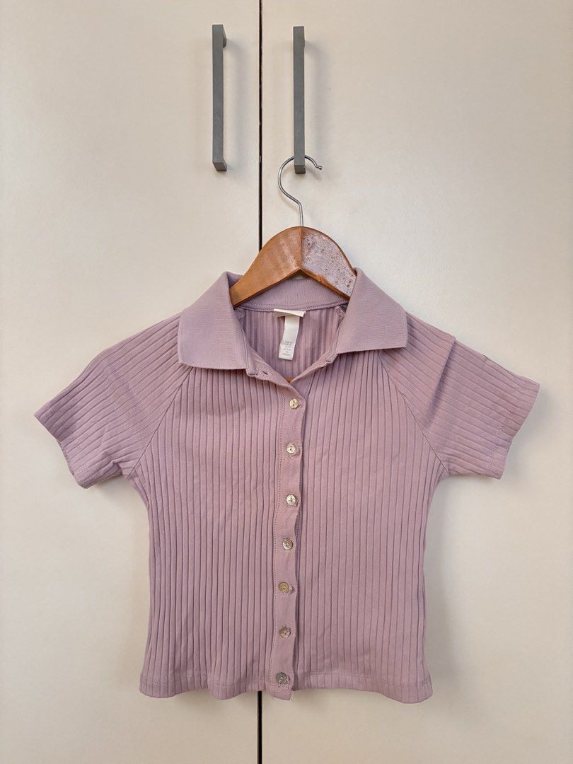 H&M Ribbed Collared Button-Up Short Sleeve Top XS (Category: Blouses) located in Manila. Submitted by mitzdcstr6 (Listing ID 1460004226, Image 1). Description: - Cute lilac ribbed top from H&M - Size XS - Short sleeves - Collared neckline - Button-up front - Versatile: pairs well with jeans or skirts - Super comfy and easy to wear.