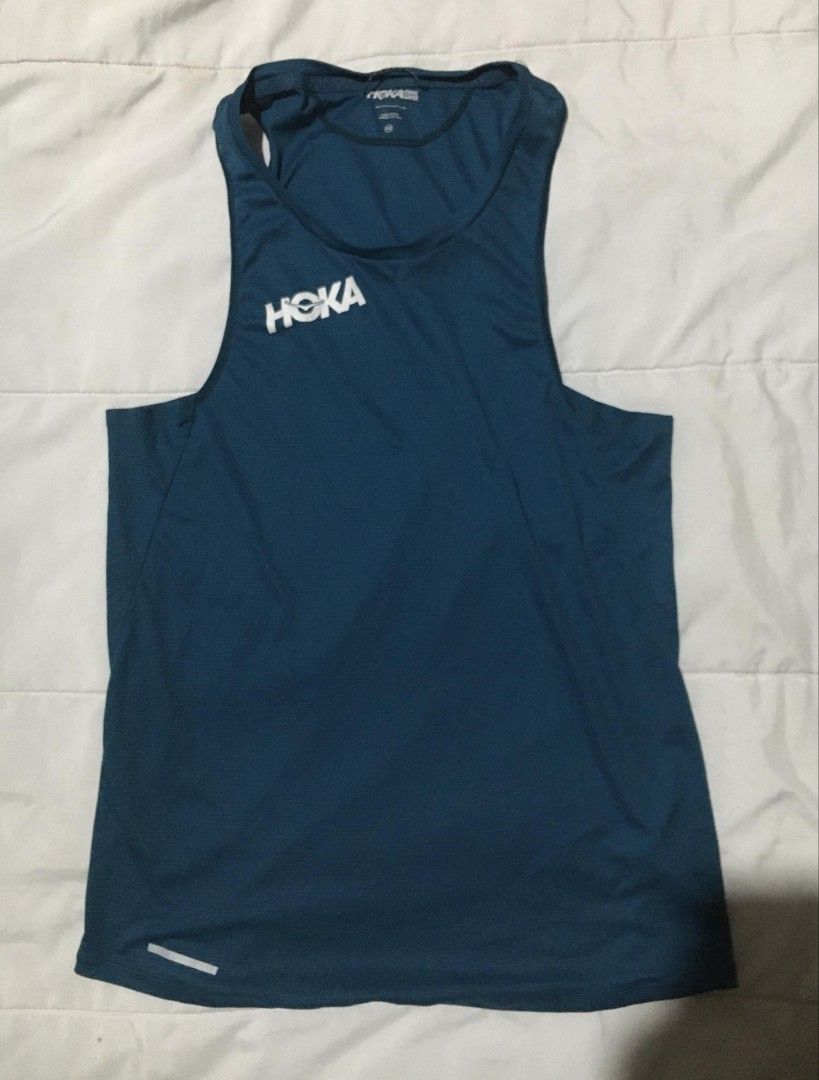 Hoka Glide Singlet (Category: Activewear) located in Quezon City. Submitted by thriftyzx (Listing ID 1460004136, Image 2). Description: Hoka Glide Singlet Size Medium Width: 16.5-17 Length: 26 Excellent Condition Meron small runs sa loob not visible sa labas see the last picture 799 Freeshipping Location: QC.