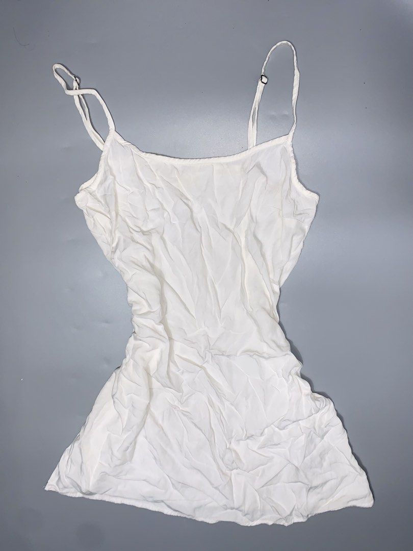 Hollister White Spaghetti Strap Top Size S (Category: Sleeveless) located in Dagupan City. Submitted by sj_styles0910. (Listing ID 1460096261, Image 1). Description: - Hollister white spaghetti strap top - Size: S - Made in Vietnam - Lightweight fabric with a crinkled texture - Adjustable straps for a customized fit - Simple and versatile design.