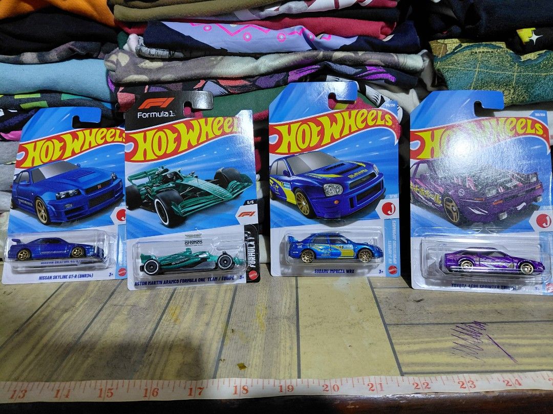 Hot Wheels Bundle 1k (Category: Vehicle & Diecast Models) located in Imus. Submitted by frootiloots4103 (Listing ID 1460090384, Image 1). Description: - Set of 4 Hot Wheels diecast cars - Includes: Purple Toyota AE86 Sprinter Trueno, Blue Subaru Impreza WRX, Green Aston Martin Formula 1, Blue Nissan Skyline GT-R (R34) - All cars are in original, unopened packaging 1000 Php aspack ALL MINT CARDS except F1 has very minimal creases on corners 📍Imus