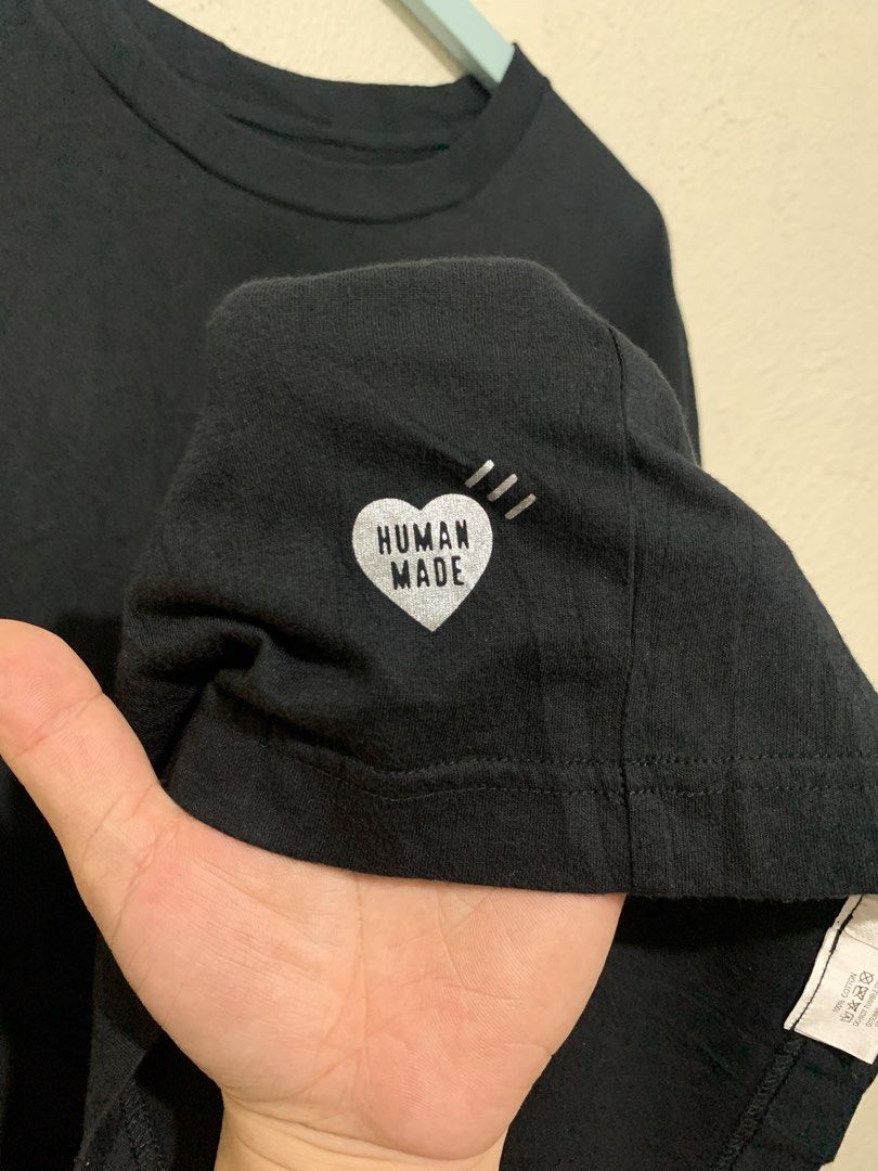 Human Made Black Cotton T-Shirt (Category: Tshirts & Polo Shirts ) located in Tiaong. Submitted by nycko.concha (Listing ID 1460049616, Image 3). Description: Human Made Black Cotton T-Shirt •Size: Large •Width: 22.5 •Length: 28 •Condition: Excellent Used •Issue: None •Color Rate: 9.7/10 •Courier: J&T Express •Location: Quezon Province Note: color may appear darker or lighter due to lighting, kindly refer to details and manage your expectations..