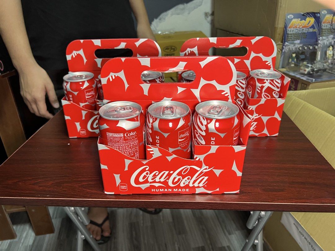 HUMAN MADE x Coca-Cola Limited Edition Cans (Category: Vintage Collectibles) located in Manila. Submitted by thegreyhousemarket (Listing ID 1460092893, Image 1). Description: - Limited Edition HUMAN MADE x Coca-Cola Can Set - Features iconic Coca-Cola branding - Unique HUMAN MADE heart pattern design - Ideal for collectors and fans of both brands - A rare find!.