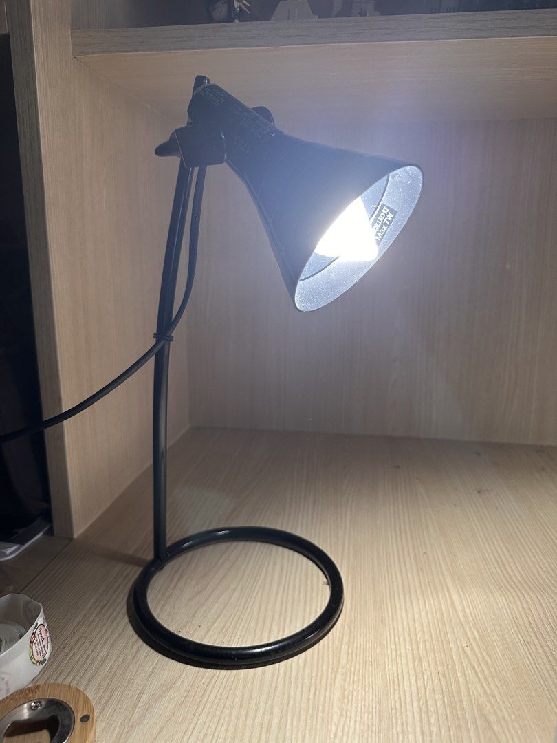 IKEA LAGRA Black Adjustable Desk Lamp with LED Bulb (Category: Lighting) located in Makati City. Submitted by rmgcloset (Listing ID 1460049924, Image 2). Description: - Adjustable black desk lamp - Includes LED bulb - Flexible neck for easy positioning - Ideal for studying or working - Plugs into standard wall outlet - In good working condition.