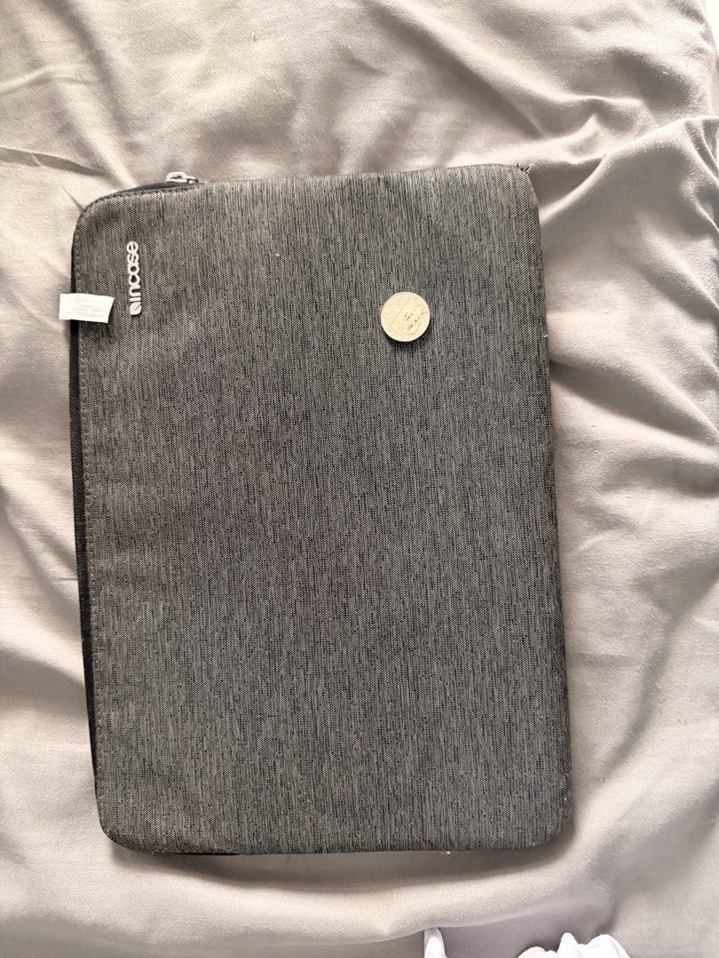 Incase Grey Laptop Sleeve (Category: Laptop Bags & Sleeves) located in Manila. Submitted by ellede32655 (Listing ID 1459971393, Image 1). Description: - Grey Incase laptop sleeve - Zipper closure - Soft interior lining for device protection - Fits most 13-inch laptops - Perfect for everyday use and travel - Keeps your laptop safe and scratch-free - Simple and functional design.