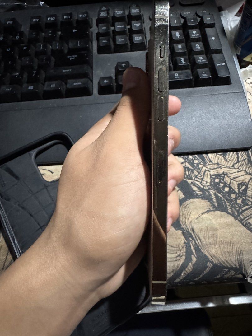 iPhone 12 Pro Max (Category: iPhone 12 Series) located in Iloilo. Submitted by joshua9271 (Listing ID 1460063185, Image 3). Description: iPhone 12 Pro Max Gold 128gb 74% Battery Health Openline Truetone and FaceID working Minimal scratches With Spigen case and charging cable Honest issue: Backglass broken and Front screen has crack but still working Negotiable (May LP para sa sure buyer) Meetup: Iloilo City.