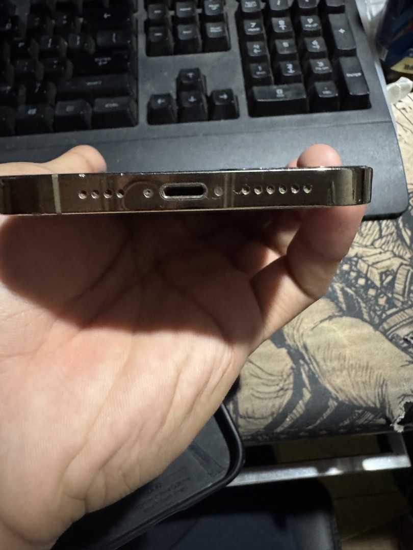 iPhone 12 Pro Max (Category: iPhone 12 Series) located in Iloilo. Submitted by joshua9271 (Listing ID 1460063185, Image 2). Description: iPhone 12 Pro Max Gold 128gb 74% Battery Health Openline Truetone and FaceID working Minimal scratches With Spigen case and charging cable Honest issue: Backglass broken and Front screen has crack but still working Negotiable (May LP para sa sure buyer) Meetup: Iloilo City.