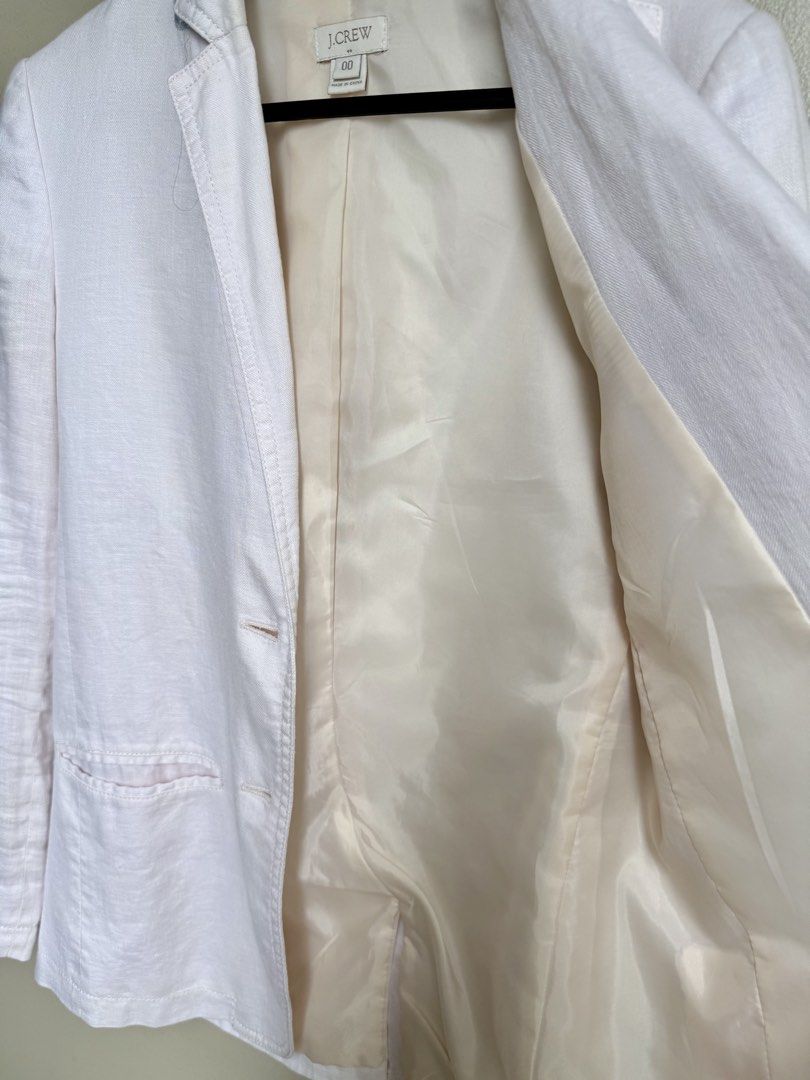 J. Crew Off-White Linen Blazer Size 00 (Category: Coats, Jackets and Outerwear) located in Pasig City. Submitted by lonelydove (Listing ID 1460034047, Image 2). Description: - White J. Crew blazer - 100% linen fabric - Polyester lining - Two-button front closure - Three buttons on each cuff - Ideal for layering or standalone wear - Perfect for warmer weather Actual measurements on item laying flat: Burst: 17.5 inch Shoulder: 14.5 inch Waist: 15.5