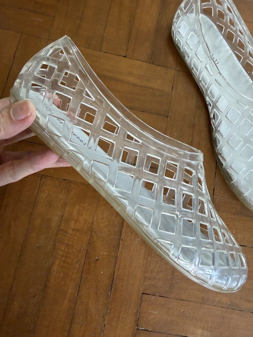 Jeffrey Campbell Clear Jelly Flats (Category: Flats & Sandals) located in Makati City. Submitted by curatedandnearlynew (Listing ID 1460023774, Image 2). Description: - Brand: Jeffrey Campbell - Style: Clear jelly flats - Design: Unique lattice pattern - Features: Easy slip-on, flexible material - Comfort: Comfortable for all-day wear - Occasion: Great for casual outings or beach days - Fun addition to any outfit.