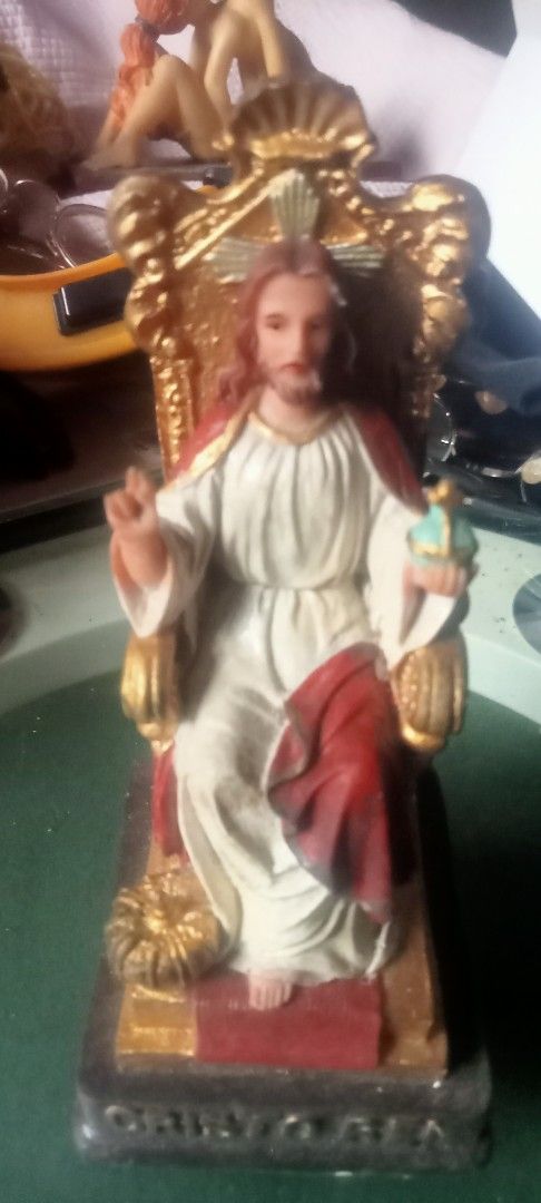 Jesus Christ Figurine on Throne with Orb (Category: Religious Items) located in Paranaque City. Submitted by dimaguilaa94969 (Listing ID 1460043842, Image 1). Description: - Majestic figurine of Jesus Christ seated on a golden throne. - Holding a symbolic orb in his left hand. five inches - Right hand raised in a gesture of blessing or authority. - Base features the inscription 'CHRISTUS'. - Ideal for home display, altars, or as a thoughtful reli