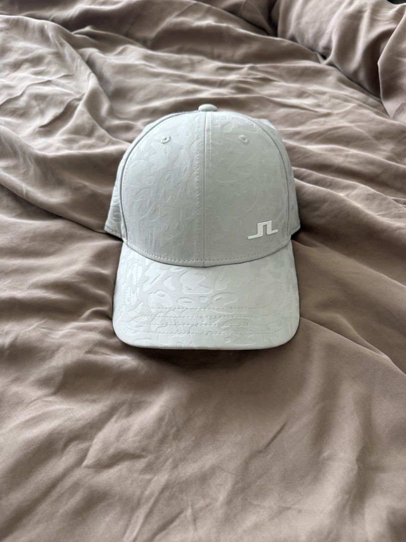 j.lindeberg Cap - Light Grey Patterned Golf Hat (Category: Caps & Hats) located in Cebu City. Submitted by takeitfrom.me (Listing ID 1459945060, Image 1). Description: - Light grey J.Lindeberg cap - Subtle all-over pattern - Classic baseball cap style - Curved brim - J.Lindeberg logo on front - Ideal for golf or everyday wear.