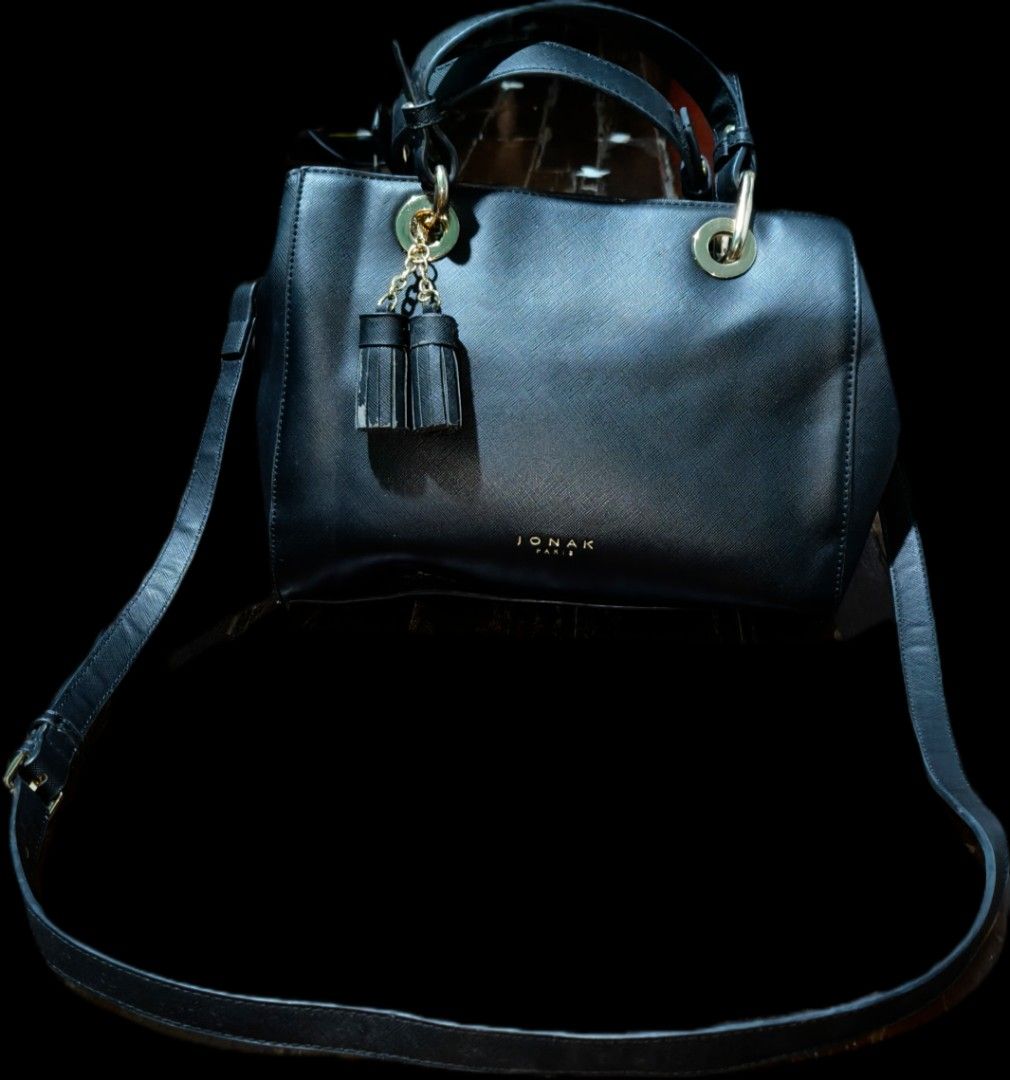 Jonak Paris two way leather bag (Category: Luxury Bags & Wallets) located in Quezon City. Submitted by morningstar_52 (Listing ID 1460084401, Image 1). Description: - Brand: JONAK PARIS - Color: Black - Material: Textured Leather - Features: Top handle, detachable shoulder strap, cute tassel charm - Hardware: Gold details - Closure: Zipper top - Versatile: Ideal for everyday use or nights out.