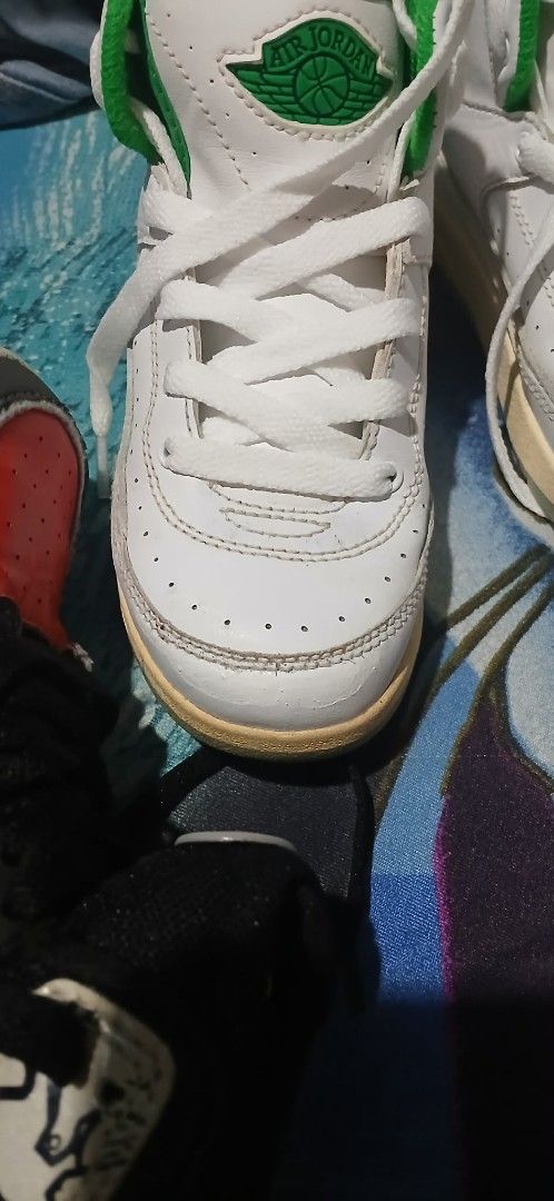 Jordan 2 Toddler Sneakers White Green (Category: Babies & Kids Fashion) located in Cavite. Submitted by crispeleno90843 (Listing ID 1459943396, Image 2). Description: - Toddler Jordan 2s - High-top style - White with green accents - Ideal for toddlers learning to walk/run - Minor scuffs on toe and sole - Clean laces.