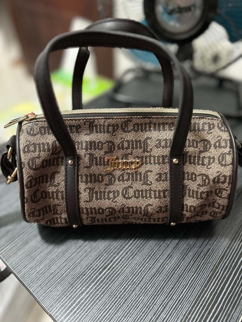Juicy Couture Barrel Bag (Category: Luxury Bags & Wallets) located in San Pablo. Submitted by anechka1823 (Listing ID 1460048290, Image 1). Description: - Authentic Juicy Couture barrel bag - Classic brown monogram print - Genuine leather trim - Secure zipper closure - Compact size, ideal for essentials - Perfect for casual outings.