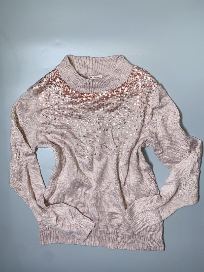 Juicy Couture Sequin Knit Sweater Size L (Category: Longsleeves) located in Dagupan City. Submitted by sj_styles0910. (Listing ID 1460095865, Image 1). Description: - Light beige Juicy Couture knit sweater - Sparkly rose gold sequins around neckline and scattered throughout - Long sleeves with ribbed cuffs - Cozy and stylish design - Versatile for dressing up or down.