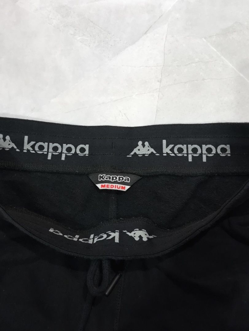 Kappa Joggers Black Medium (Category: Joggers) located in Subic. Submitted by dreyco (Listing ID 1460045829, Image 2). Description: - Black Kappa joggers - Elastic waistband with drawstring - Logo on left leg, small logo on right thigh - Tagged Medium - Comfortable for lounging or workouts.