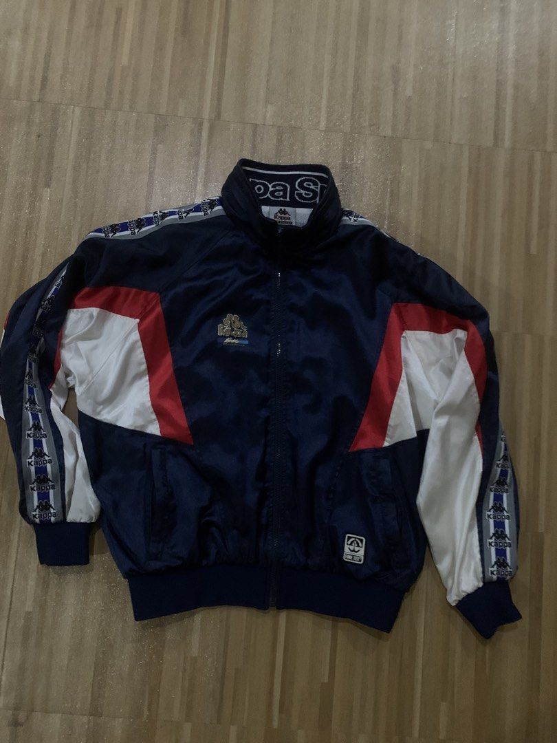 Kappa Track Jacket Navy Blue White Red Small (Category: Coats, Jackets and Outerwear) located in Dagupan City. Submitted by prelovedthatshi (Listing ID 1459900607, Image 1). Description: - Vintage Kappa track jacket - Navy blue with red and white panel details - Iconic Kappa logo tape on sleeves and collar - Comfortable mesh lining - Size: Small.