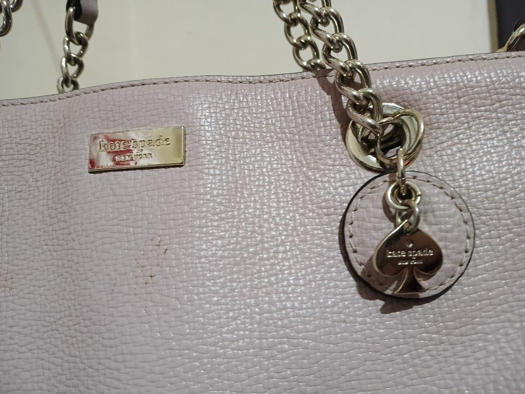 Kate Spade Pink Leather Shoulder Bag with Chain Strap (Category: Luxury Bags & Wallets) located in Cavite. Submitted by ms.de.clutter (Listing ID 1460031200, Image 2). Description: -Authentic preloved KS purchased from the US -Genuine pink leather Kate Spade shoulder bag - Textured finish for added style - Elegant chain strap - Signature spade charm detail - Multiple interior compartments for organization - Interior zip pocket for secure storage 