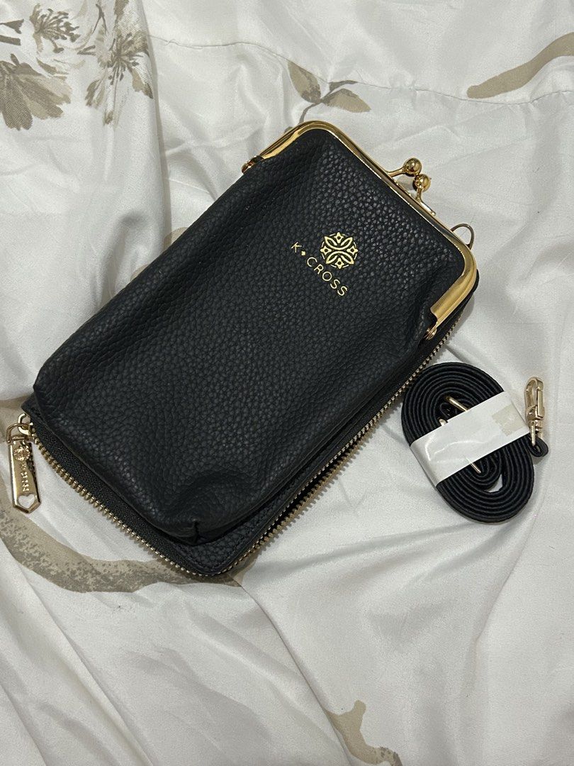 k.cross Black Pebble Leather Wallet (Category: Wallets & Card holders) located in Pasay City. Submitted by haxiea (Listing ID 1460086968, Image 1). Description: - Never used - Material: Black pebble leather - Includes: Detachable crossbody strap .